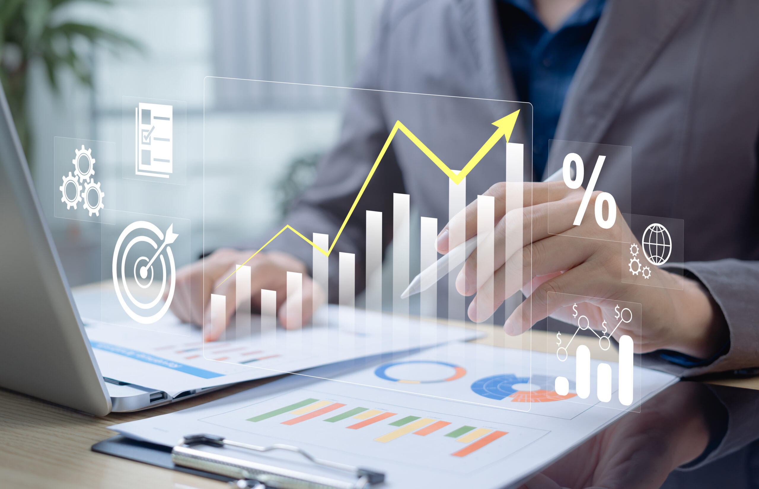 Businessman analyzing profit and quality management concepts long term cost planning, product quality, budgeting, financial forecasting, and company revenue and expense projections.